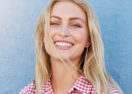 cheerful-young-woman-looking-at-camera-and-PX5UHQ2.jpg