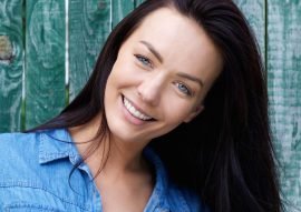 smiling-brunette-woman-with-blue-shirt-PDNUEG4.jpg